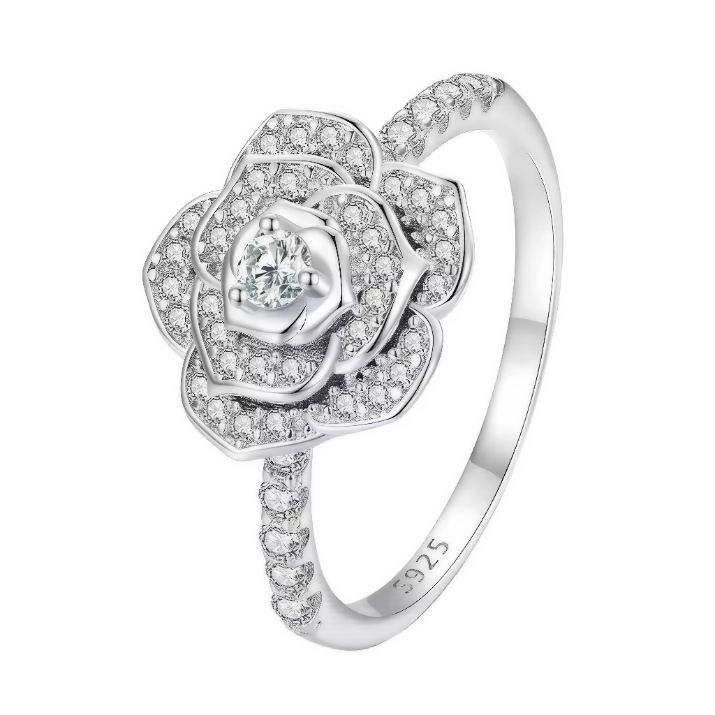 Sublimez votre main avec cette bague exceptionnelle, inspirée par la beauté éternelle de la rose ! Entièrement réalisée en argent 925, elle dévoile un motif floral raffiné, composé de pétales pavés de cristaux étincelants, avec une pierre centrale brillante qui capte toutes les lumières. Ce bijou féminin et élégant offre une finition haute qualité et un volume délicat, parfait pour sublimer toutes vos tenues, offrir lors d’un événement spécial ou compléter une collection romantique.