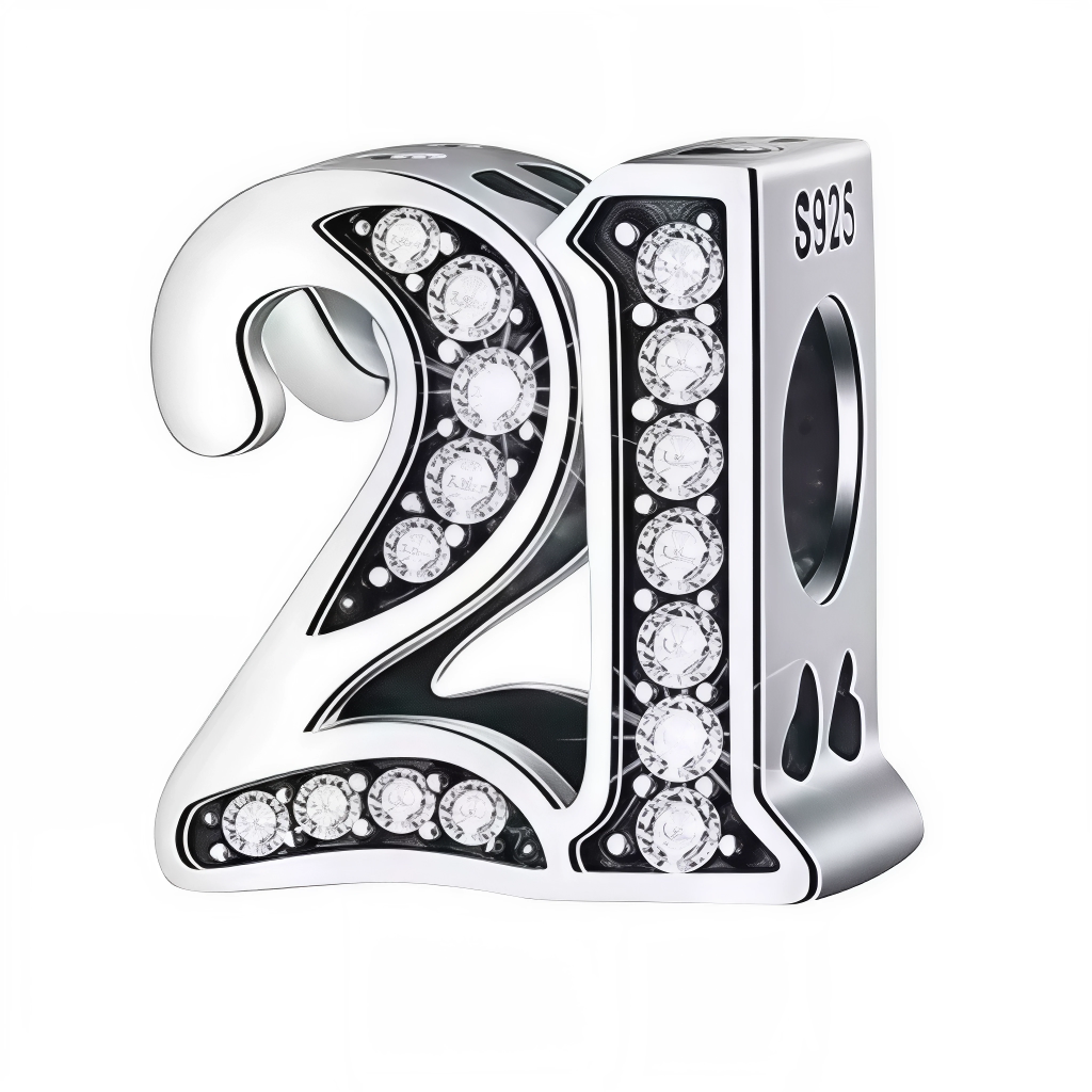 Ajoutez une touche d’éclat à votre bracelet avec ce charm en forme de chiffre "21", réalisé en argent 925 et orné de strass scintillants. Un bijou élégant et raffiné, idéal pour célébrer un anniversaire ou un moment spécial avec style.