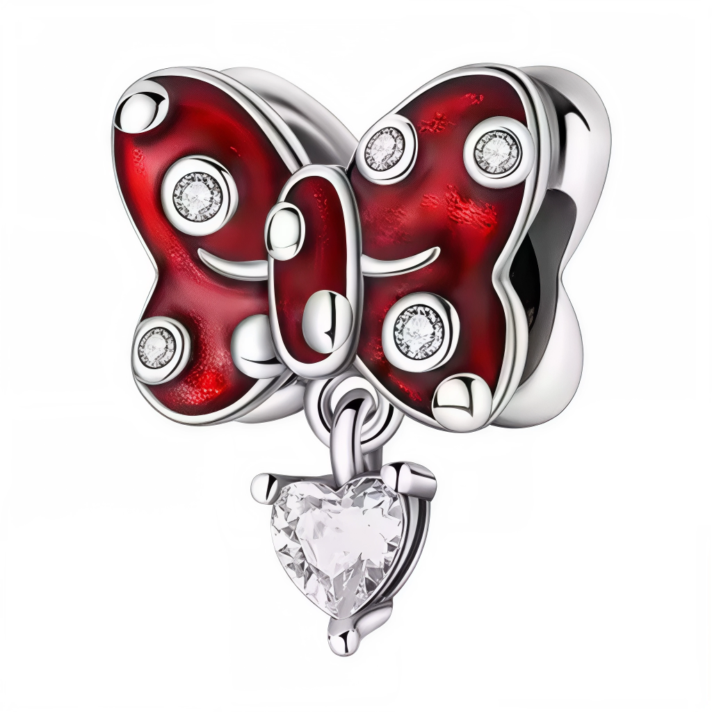 Ce charm met en scène un papillon aux ailes rouge profond en émail, ponctuées de pierres claires façon zircon pour un éclat élégant inspiré des finitions utilisées sur les charms animaux et cœur des collections contemporaines. Un petit cœur taille brillant suspendu ajoute un mouvement délicat, dans l’esprit des pendentifs cœur populaires associés aux thèmes amour et passion en joaillerie fantaisie. L’ensemble en métal argenté et détails lustrés crée une pièce lumineuse et expressive, parfaite pour composer