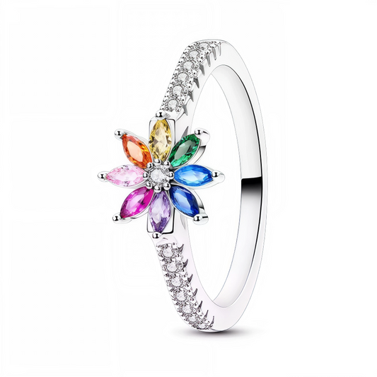 Ajoutez une note colorée et sophistiquée à votre style avec cette bague en argent 925 en forme de fleur. Chaque pétale est orné d’un cristal aux teintes variées, créant un jeu de lumière éclatant et raffiné. Un bijou idéal pour celles qui aiment allier élégance et originalité dans leurs accessoires.