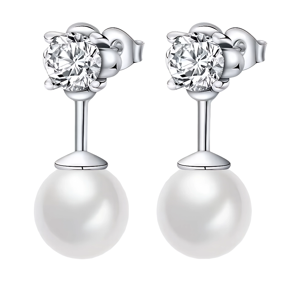 Ces boucles d’oreilles en argent 925 marient l’éclat d’un cristal rond à la douceur d’une perle lisse suspendue. Leur design épuré et raffiné en fait un indispensable du coffret à bijoux, parfait pour sublimer aussi bien une tenue de tous les jours qu’un look de soirée.

Caractéristiques :

-Matière : Argent 925/1000 massif pour la monture, orné d’un cristal synthétique transparent taille ronde et d’une perle synthétique blanche au fini nacré.
-Design : Puces d’oreilles composées d’un solitaire scintillant 
