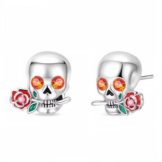 Affichez un style unique et affirmé avec ces boucles d’oreilles en argent 925 représentant une tête de mort ornée d’une rose délicate dans la bouche. Ce design audacieux allie esprit rebelle et touche romantique, parfait pour sublimer vos looks avec caractère.