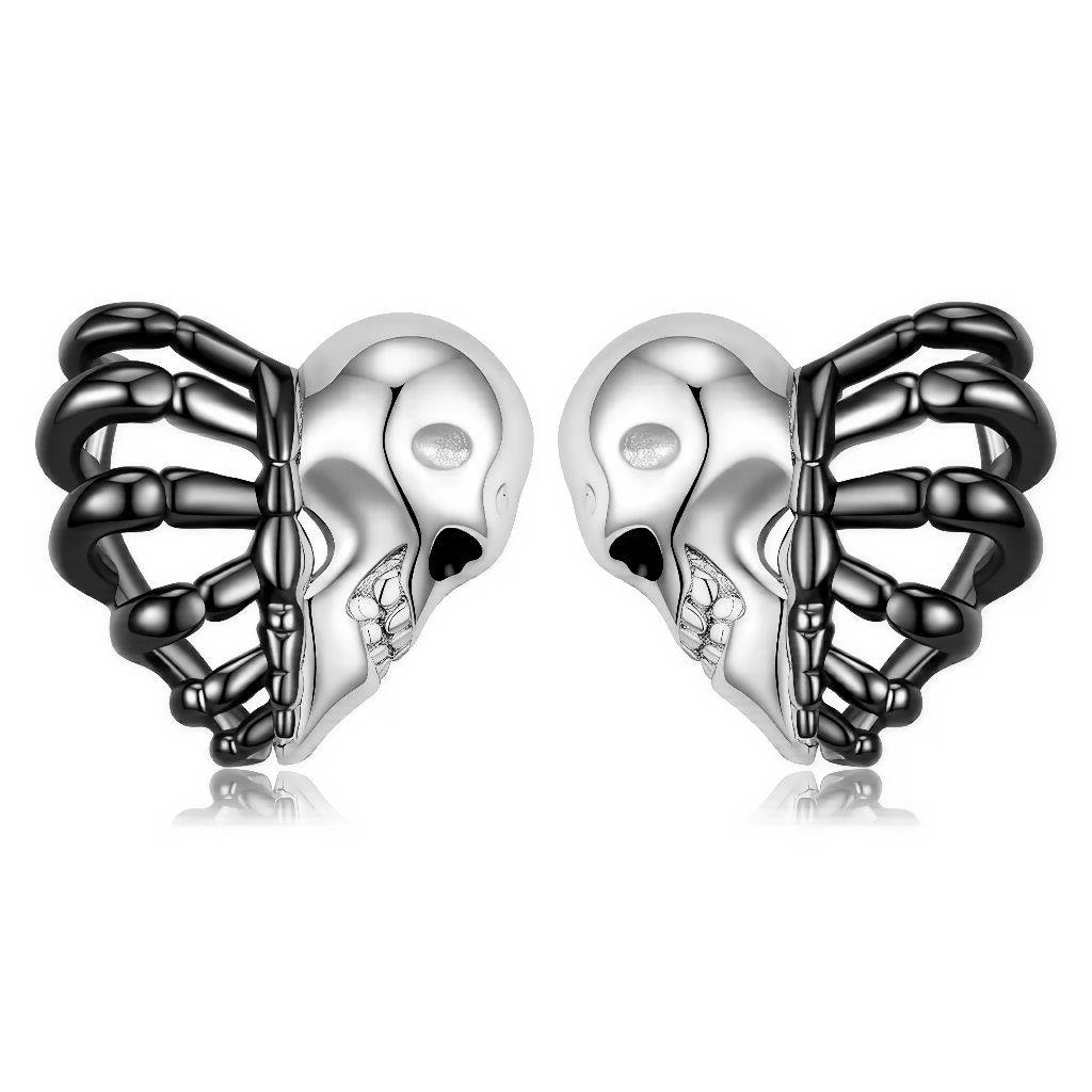 Un design audacieux inspiré du style gothique : ces boucles d’oreilles sont constituées d’une tête de mort argentée reliée à une cage thoracique noire qui dessine la forme d’un cœur. La dualité du métal brillant et du noir ajouré crée un contraste puissant et original, idéal pour incarner l’esprit Halloween, rock ou alternatif. Ce bijou apporte une touche d’art anatomique et de symbolique forte à toutes les tenues.

Caractéristiques
Matière : Argent 925, finition noire et argentée
Design : Tête de mort, cag