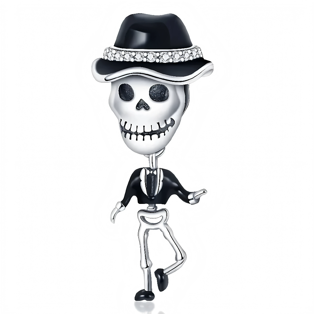 Le squelette est entièrement en argent 925, coiffé d’un grand chapeau noir orné d’un bandeau de zircons clairs, avec un visage souriant de style Dia de los Muertos. Il porte une veste et une cravate émaillées de noir, le corps articulé suggérant un squelette en plein pas de danse.