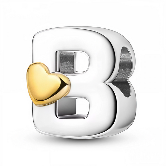 Apportez une touche tendre et raffinée à votre bracelet avec ce charm en forme de lettre "B", réalisé en argent 925 et décoré d’un petit cœur couleur or. Ce bijou allie élégance et douceur, idéal pour personnaliser votre bijou avec une initiale pleine de charme.