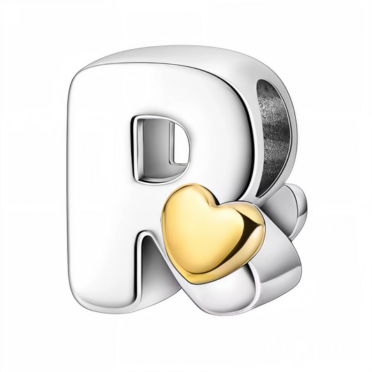 Exprimez votre affection avec ce charm en forme de lettre "R", façonné en argent 925 et orné d’un petit cœur doré délicat. Un bijou élégant et personnel, parfait pour ajouter une touche sentimentale à votre bracelet.