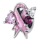 Charm élégant représentant un ruban rose, symbole de soutien et de sensibilisation à la lutte contre le cancer du sein. Finement travaillé en argent 925, il est orné de détails roses scintillants et de pierres en forme de cœur, pour un bijou délicat, lumineux et porteur de sens.

Caractéristiques :
Matière : Argent 925 avec détails roses et pierres brillantes.
Design : Ruban rose accompagné de pierres en forme de cœur.
Style : Élégant, féminin, délicat et symbolique.
Symbolique : Soutien, courage, espoir, s