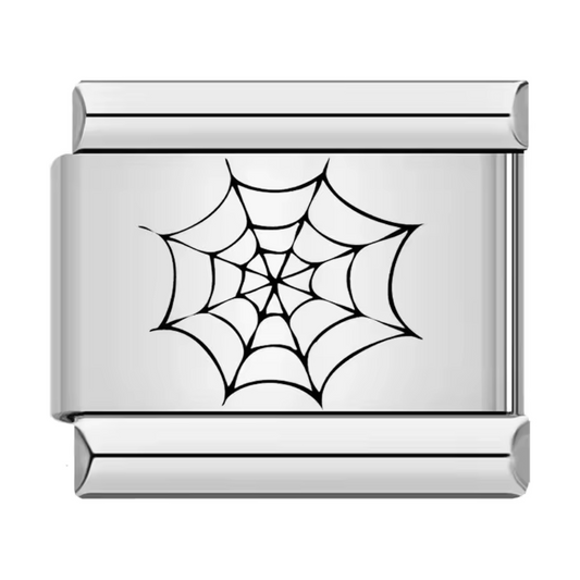 Ce charm italien en acier inoxydable argenté représente une toile d’araignée noire finement dessinée, apportant une touche mystérieuse et originale à votre bracelet. Avec son design précis et ses détails subtils, il séduira les amateurs de motifs uniques et audacieux. Facile à fixer, il s’adapte parfaitement à nos bracelets composés de 17 maillons extensibles et réglables, convenant à toutes les tailles de poignet. Compatible avec tous nos charms italiens, ce bijou est idéal pour personnaliser votre bracele
