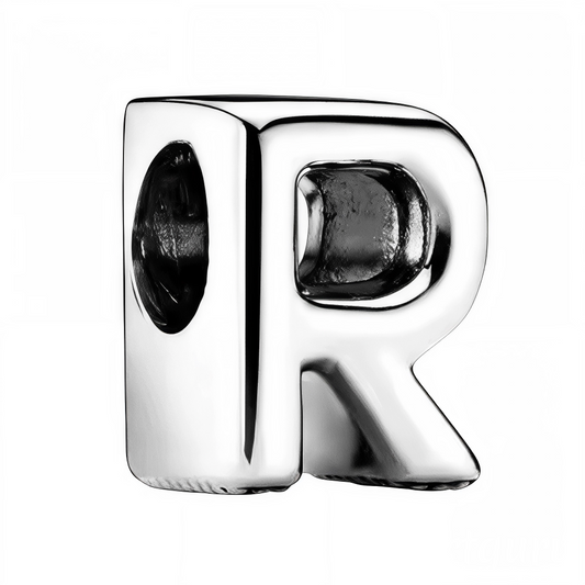 Personnalisez votre bracelet avec élégance grâce à ce charm en forme de lettre "R", réalisé en argent 925. Un bijou simple et raffiné, idéal pour exprimer votre personnalité ou offrir une attention symbolique à un être cher.