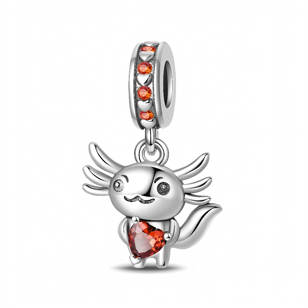 Suspendu à une bélière sertie de cristaux orange, l’axolotl en argent présente ses branchies stylisées comme de petites ailes et un regard pétillant très expressif. Entre ses pattes, il tient un grand cœur taille brillant dans une teinte orangée chaleureuse, qui apporte une touche de couleur vive et rappelle la joie de partager ses sentiments. Ce bijou au design ludique et attendrissant est idéal pour les fans d’axolotls, les amoureux des animaux kawaii ou pour offrir un message de love fun et original.
