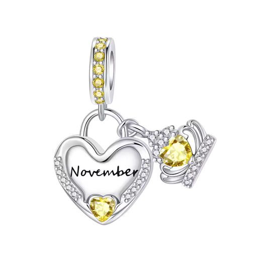 Illuminez la fin d’année avec ce charm pendentif en argent 925 en forme de cœur, délicatement orné de strass jaunes éclatants. Au centre, l’inscription « November » gravée apporte une touche personnalisée, tandis que la pierre jaune en forme de cœur symbolise la joie et la lumière. Ce charm pendentif est idéal pour célébrer un anniversaire de novembre ou offrir un cadeau unique, chargé de sens et de chaleur.