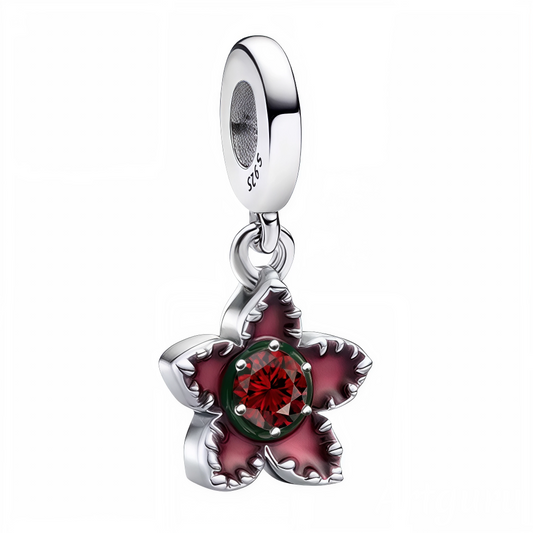 Faites éclore l’élégance dans votre collection avec ce charm pendentif en argent 925 représentant une fleur délicatement ouvragée, colorée de rouge en son cœur et ornée d’une pierre rouge scintillante en son centre. Ce bijou raffiné incarne la passion, la beauté et la féminité avec une touche de brillance subtile. Idéal pour celles qui aiment les pièces florales pleines de caractère.