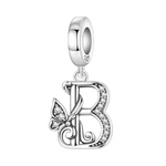 Exprimez votre élégance et votre personnalité avec ce charm pendentif en argent 925 représentant la lettre "B" stylisée dans un design raffiné. La lettre est ornée de strass scintillants qui ajoutent une touche de brillance délicate, accompagnée d’un petit papillon argenté symbolisant légèreté et liberté. Un bijou chic et sophistiqué, parfait pour personnaliser votre bracelet ou offrir un cadeau significatif.