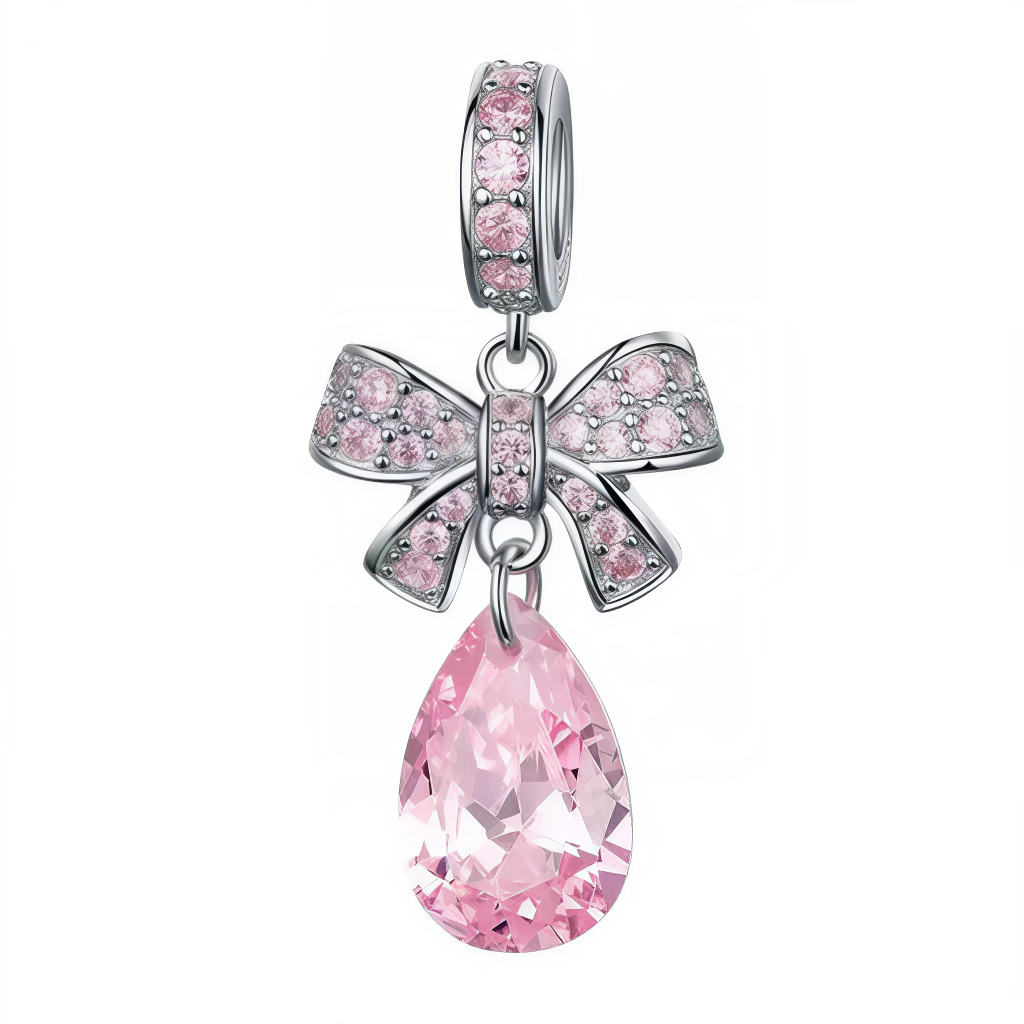 Ce charm féminin délicat arbore un grand nœud rose pâle serti de cristaux roses multiples sur les boucles et extrémités effilées, prolongé d'une goutte oblongue cristalline rose intense chatoyante. Les lignes fluides et scintillements subtils expriment grâce sophistiquée du pendentif. Symbole d'élégance raffinée et tendresse joyeuse, il noue les bracelets d'un éclat girly intemporel.

Caractéristiques

Matière : Argent 925 avec cristaux roses multiples.
Design : Nœud boucles serties, goutte suspendue chaîne