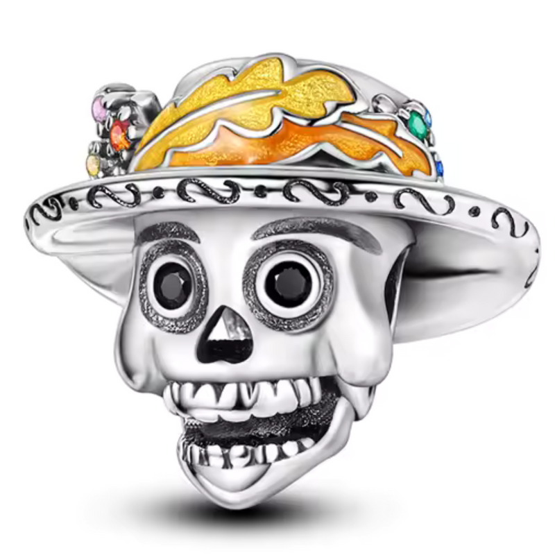 Ce charm en argent 925 met en scène crâne souriant sous sombrero large bord ondulé, couronne feuilles automnales orange émaillées pierres colorées multicolores, yeux noirs pétillants dents ouvertes joyeuses. Symbole fête Día de Muertos célébration vie colorée.

Caractéristiques :

Matière : Argent 925 émail orange pierres.
Design : Crâne chapeau décoré, bélière supérieure.
Compatibilité : Bracelets colliers thèmes Halloween fêtes.