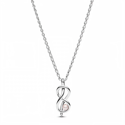 Alliant élégance et symbolisme, ce collier "Nœud de l'Infini" est un véritable hommage à l'amour éternel. Au centre, une perle rose lumineuse est magnifiquement encadrée par le symbole infini, créant un design délicat et raffiné. Réglable pour un ajustement parfait, ce bijou apportera une touche de douceur et de romantisme à toutes vos tenues.