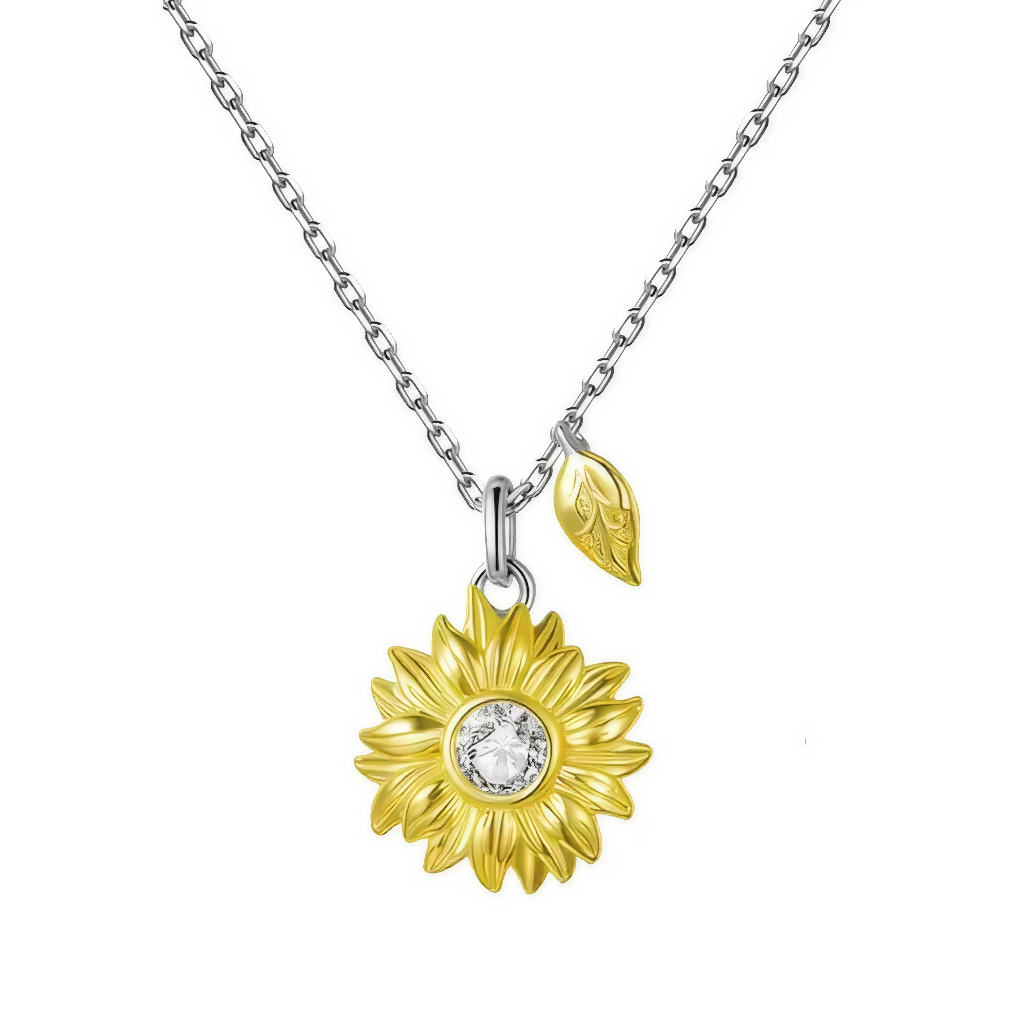 Ce collier en argent 925 met en scène un délicat pendentif tournesol doré suspendu à une fine chaîne, accompagné d’une petite feuille assortie. Le cœur du tournesol, orné d’un cristal scintillant, symbolise la lumière intérieure et la joie, pour un bijou à la fois solaire et plein de douceur.

Caractéristiques :

-Matière : Argent 925/1000 massif pour la chaîne et l’anneau, finition brillante, pendentif tournesol doré orné d’un cristal synthétique transparent au centre.
-Design : Collier à chaîne fine maill