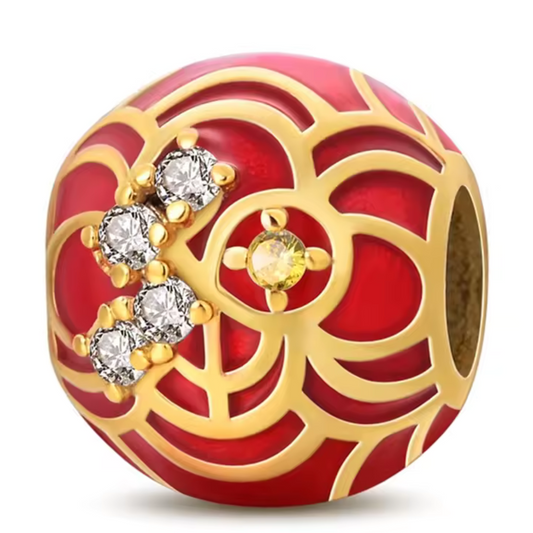 Charm mit traditionellem Motiv in Rot und Gold